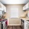 Kitchen area with appliances and cabinets for ample storage