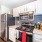 kitchen area with cabinets and storage pantry