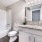 Bathroom with cabinets and shower with bath tub
