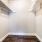 walk in closet with shelves and hanging racks